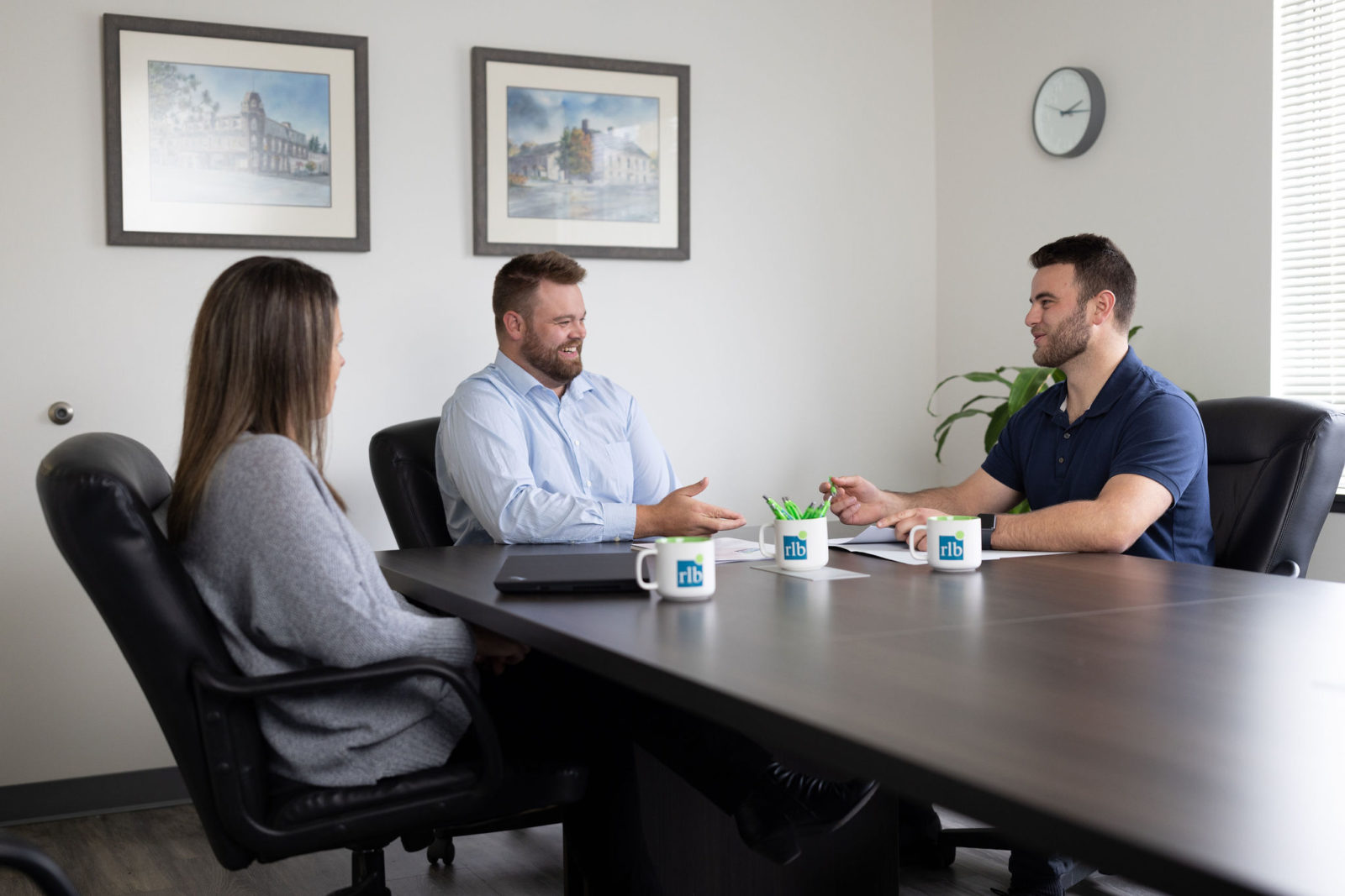 People having a meeting at the RLB Fergus office.