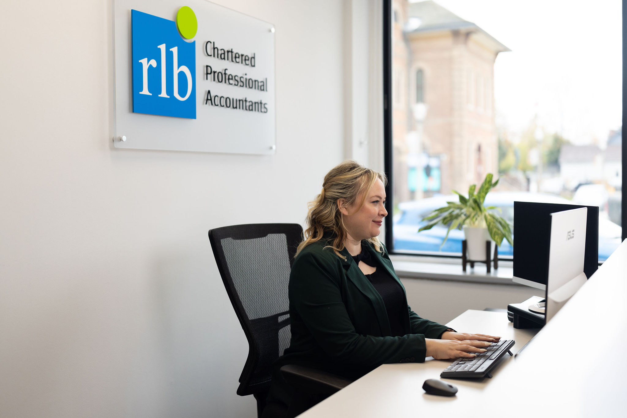 Woman sitting at reception desk